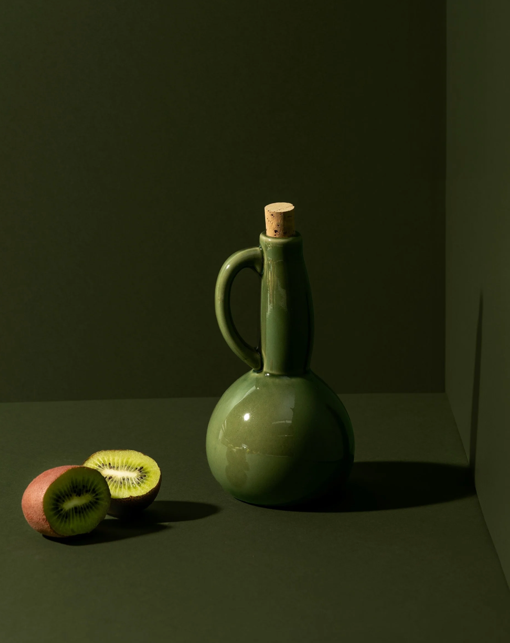 Handmade stoneware olive oil cruet with a narrow pour spout, by Gharyan.
