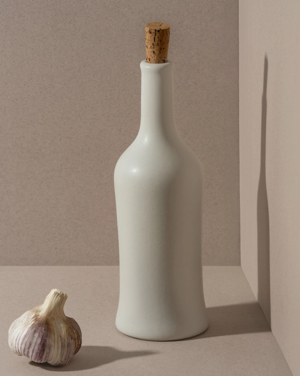 Tunisian stoneware olive oil dispenser, 21oz capacity with a smooth matte finish for the kitchen.