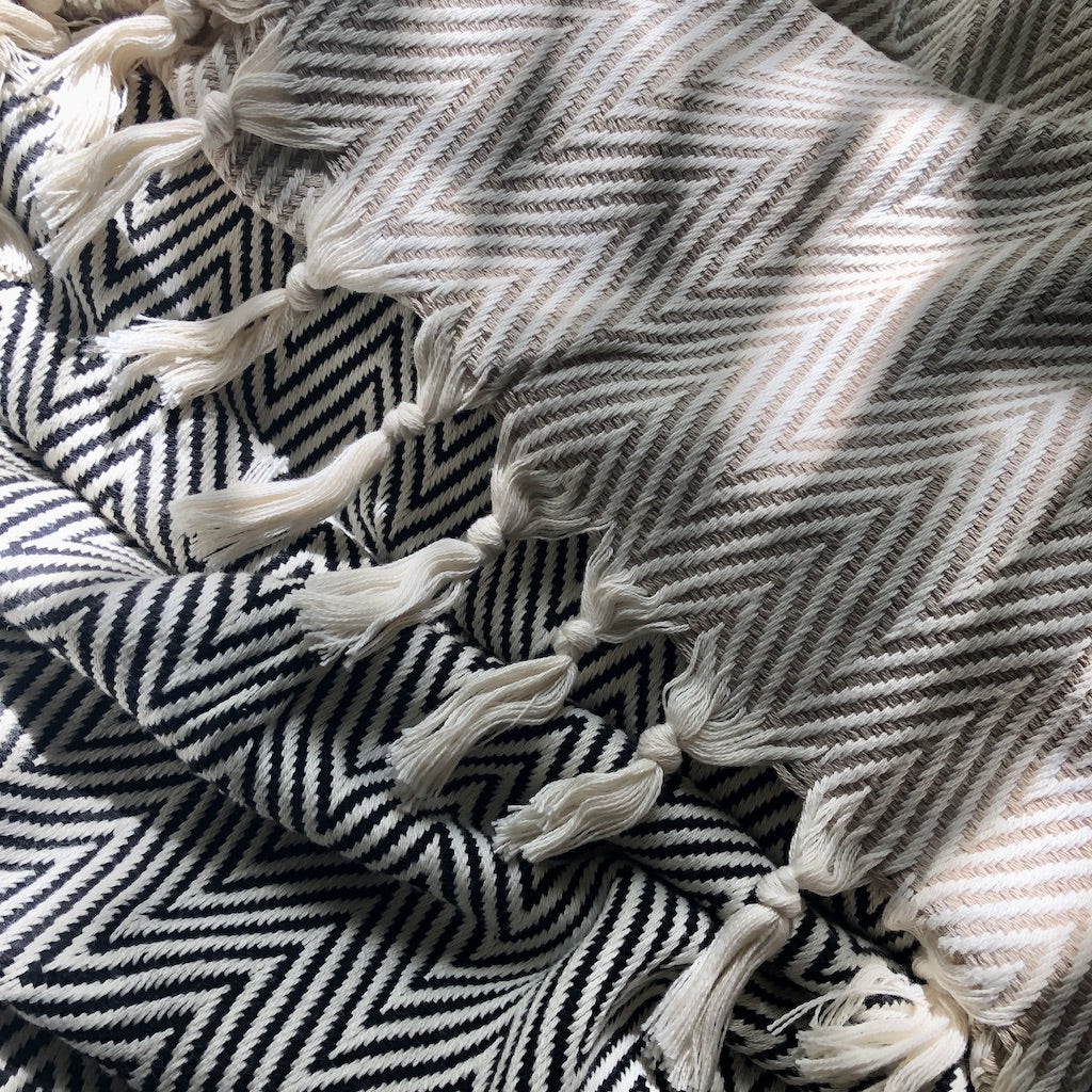 Beige handwoven chunky chevron Turkish throw blanket with a geometric pattern.