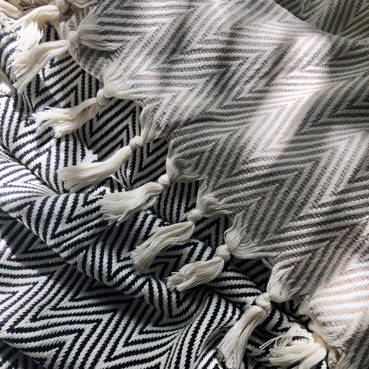 Beige handwoven chunky chevron Turkish throw blanket with a geometric pattern.