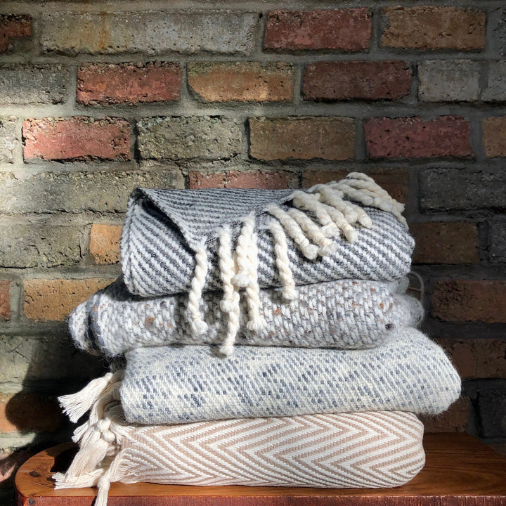 Handwoven beige chunky chevron Turkish throw blanket with a textured pattern.