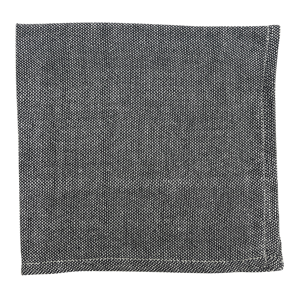 Black handloom dinner napkins in Ethiopian cotton with a textured weave.