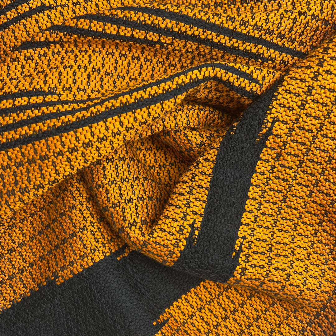 Bronze Cambodian handloom organic cotton throw with intricate woven patterns.
