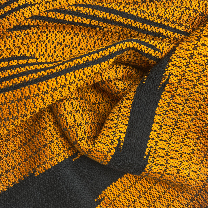 Bronze Cambodian handloom organic cotton throw with intricate woven patterns.