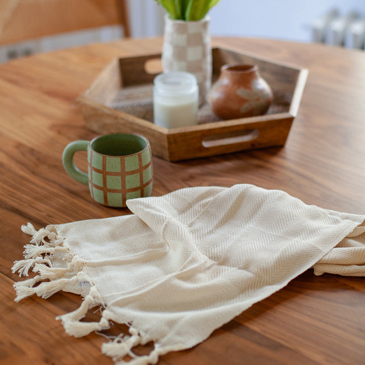 Champagne herringbone Turkish cotton hand towel with a soft, textured pattern.