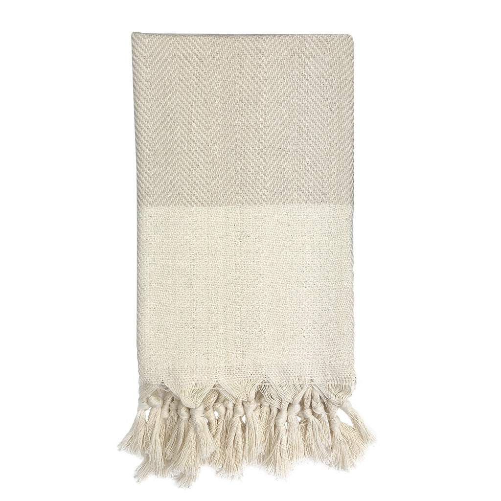 Champagne herringbone Turkish cotton hand towel with a textured pattern.