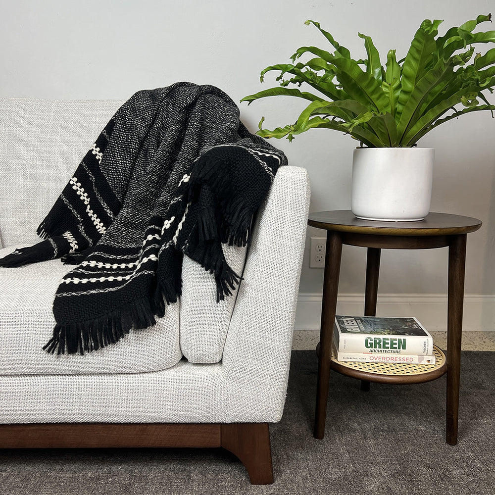 Chunky alpaca throw blanket in black with cream stripes and tasseled fringe