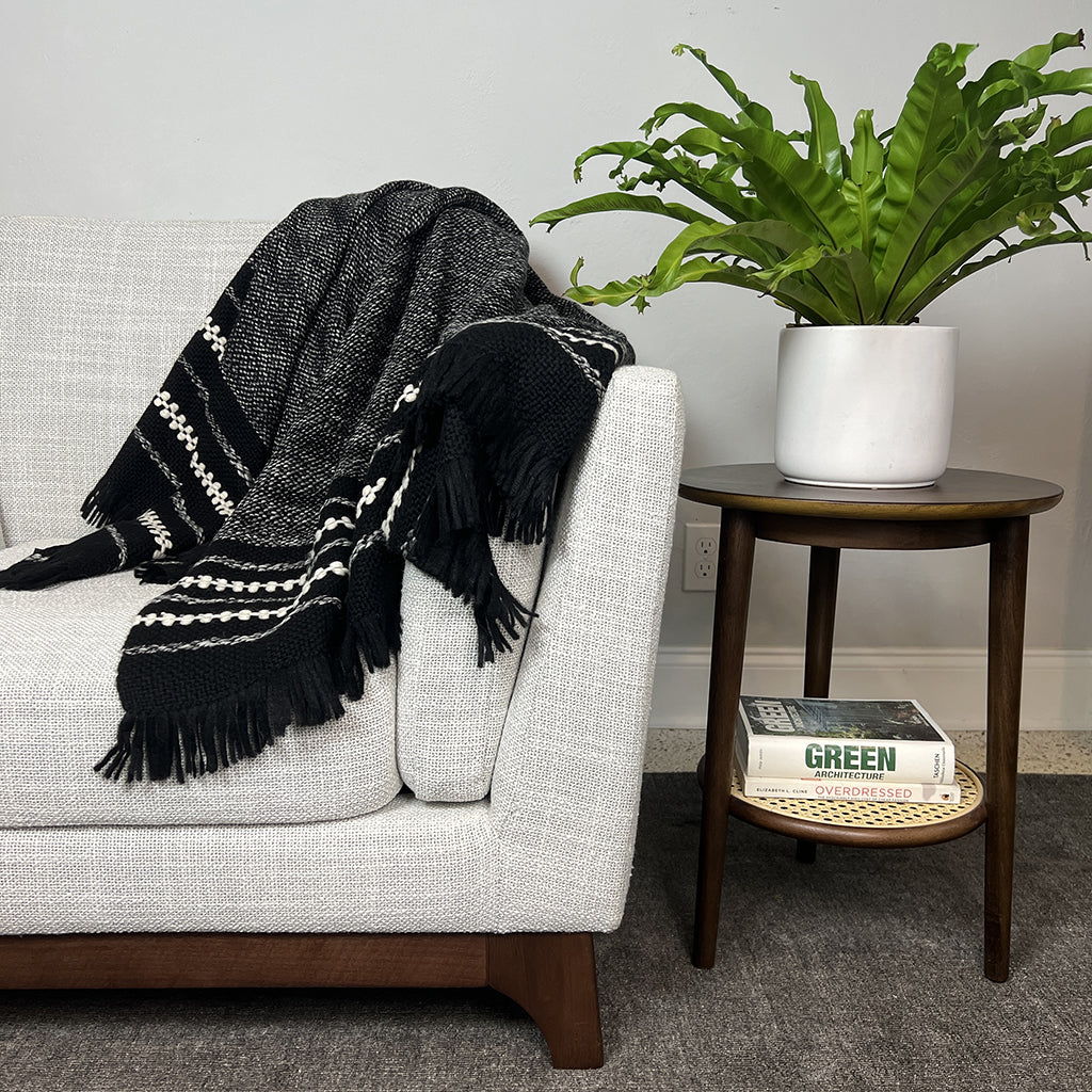 Chunky alpaca throw blanket in black with cream stripes and tasseled fringe