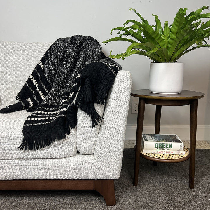Chunky alpaca throw blanket in black with cream stripes and tasseled fringe