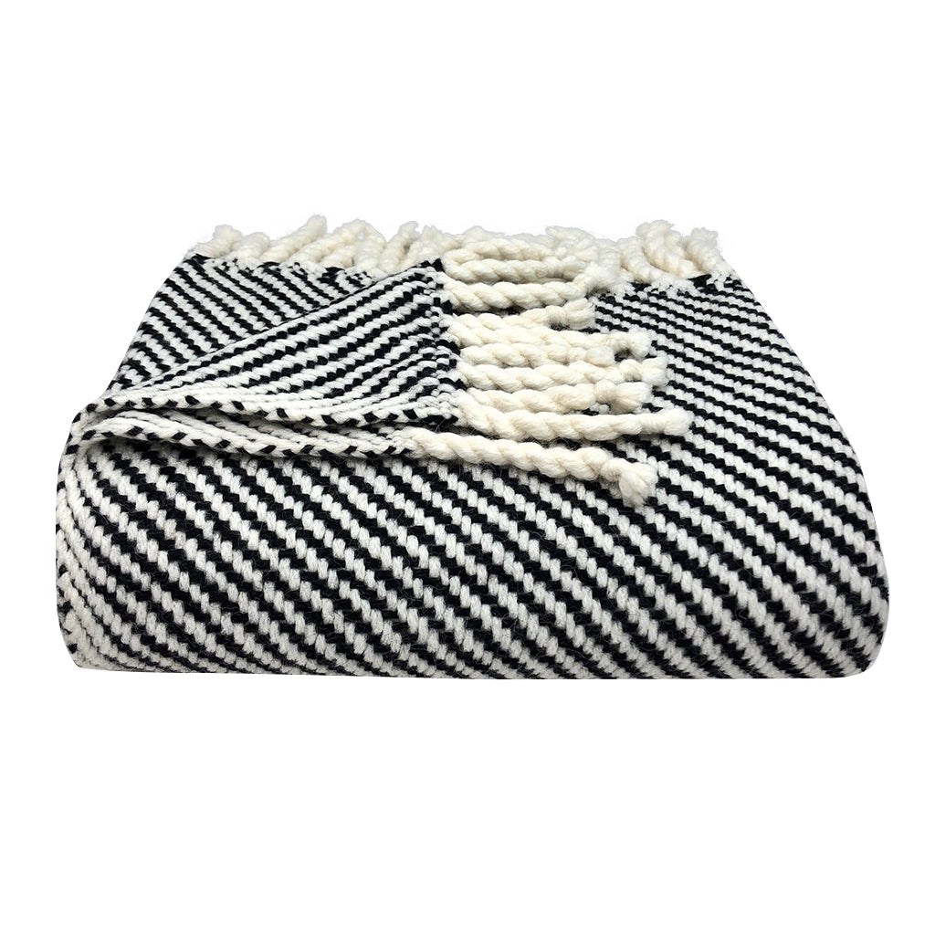 Chunky black stripe alpaca throw blanket, soft and cozy with a bold stripe pattern.