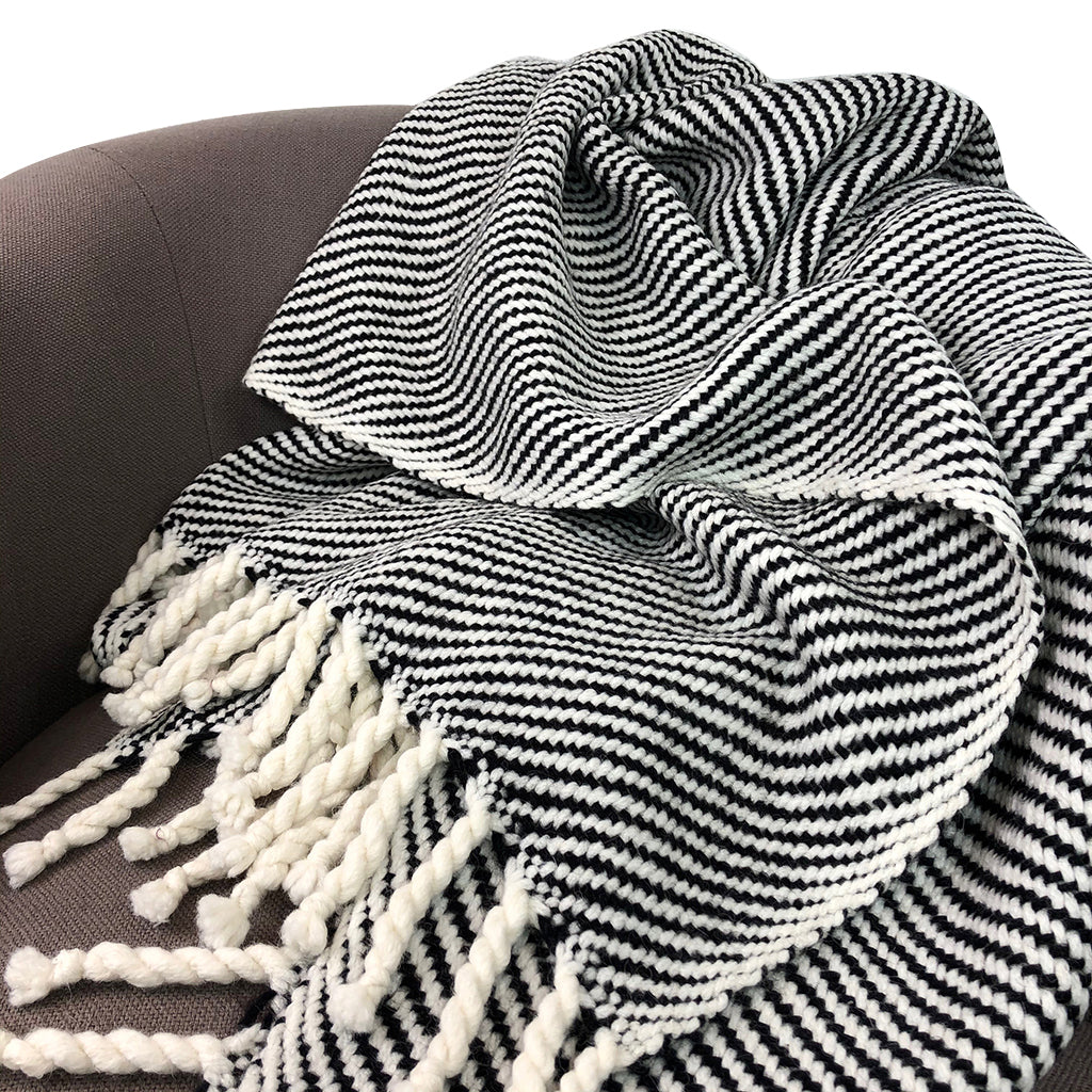 Chunky black stripe alpaca throw blanket with soft fabric and a bold stripe pattern.