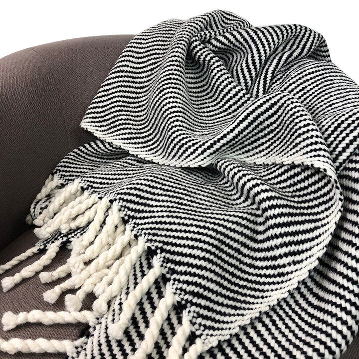 Chunky black stripe alpaca throw blanket with soft fabric and a bold stripe pattern.