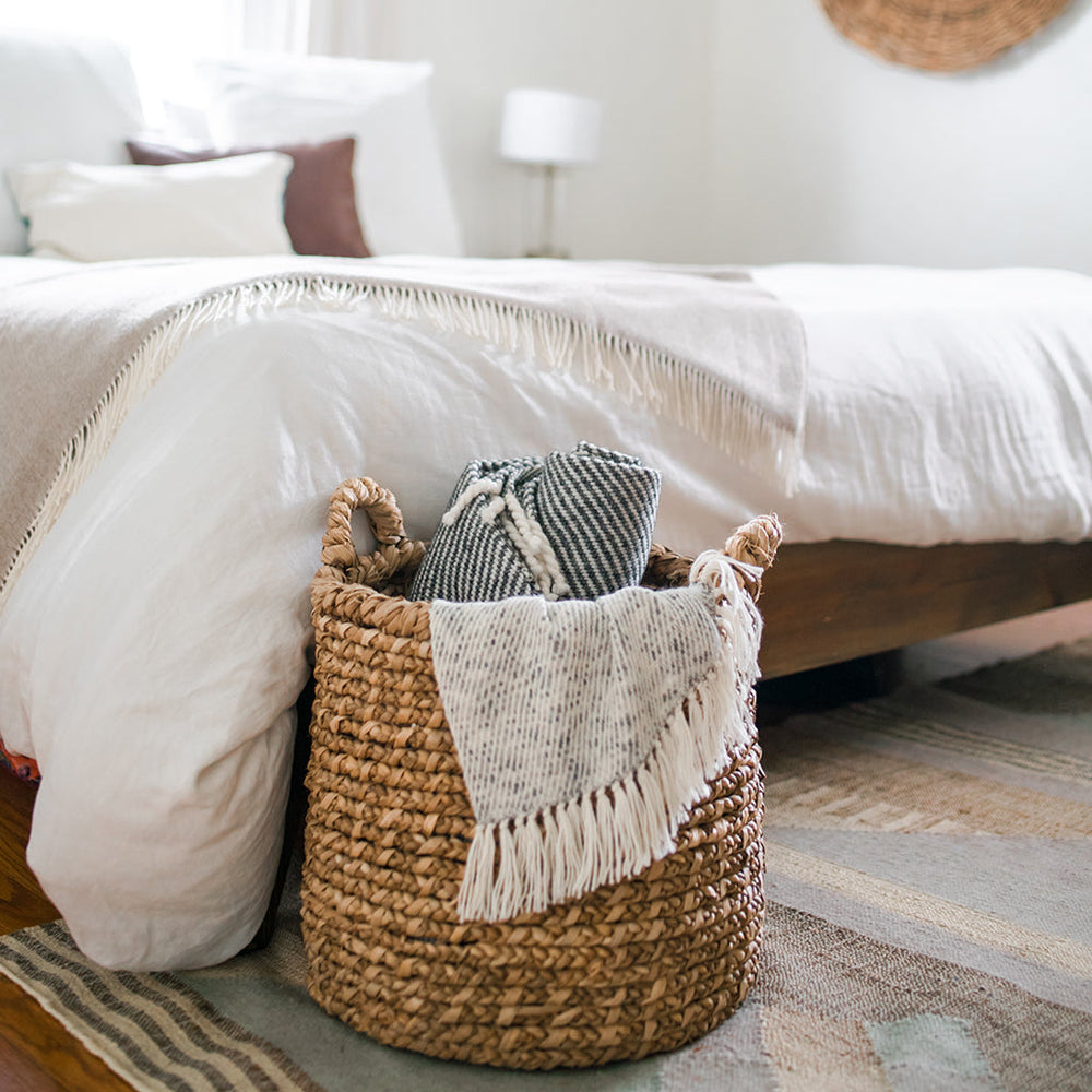 Chunky black stripe alpaca throw blanket with soft, woven fabric and bold stripes.