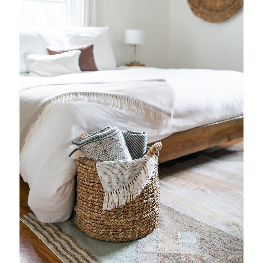 Chunky gray weave alpaca throw blanket, soft and cozy with a textured knit pattern.