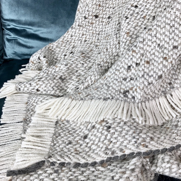 Gray chunky alpaca weave throw blanket with soft, textured fabric.
