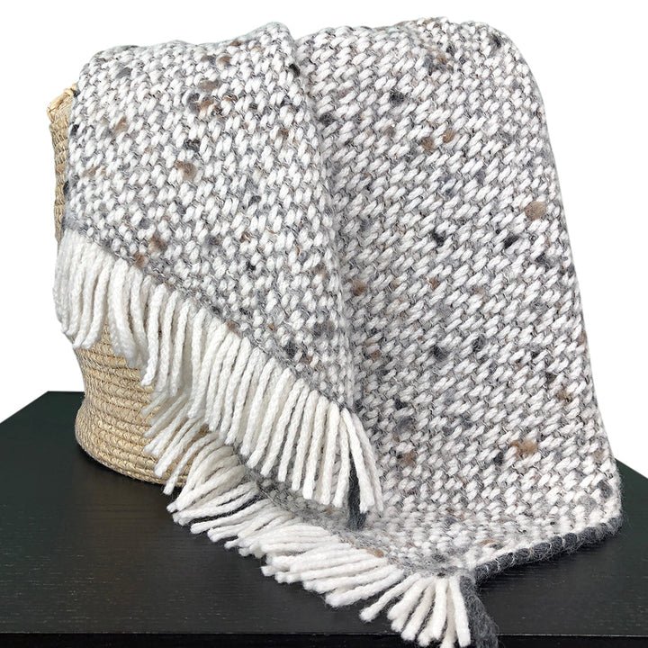 Chunky gray weave alpaca throw blanket with soft, textured fabric.