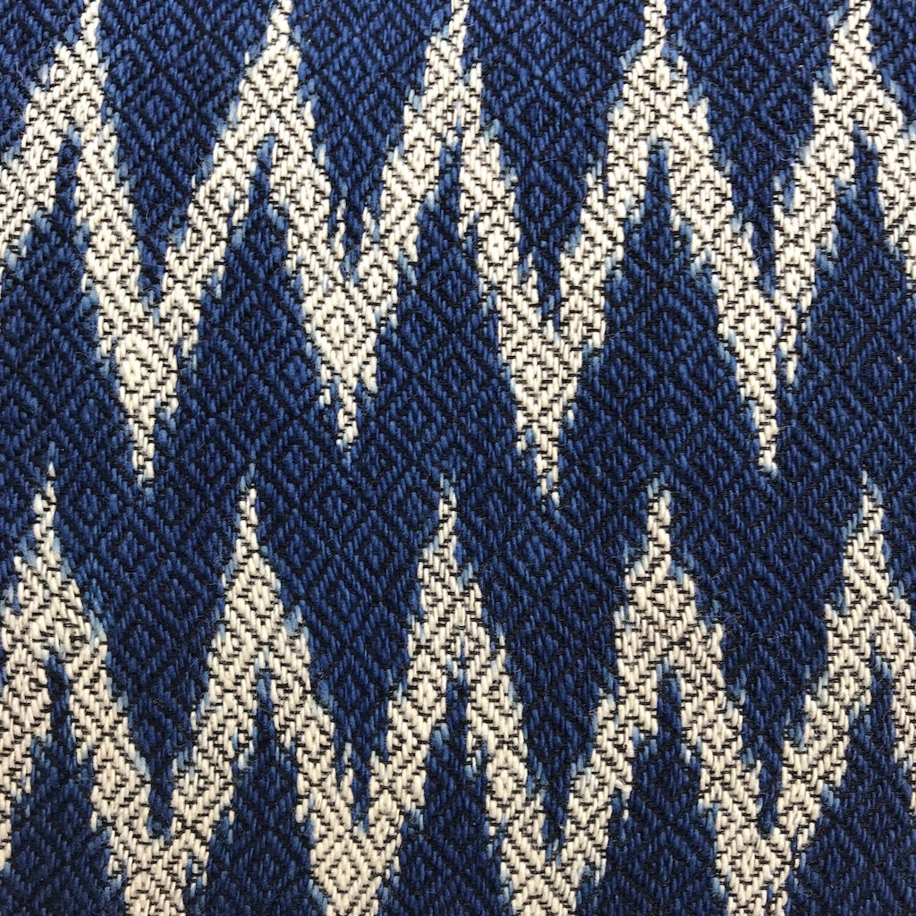 Indigo chevron pillow cover with a geometric chevron pattern on soft fabric.