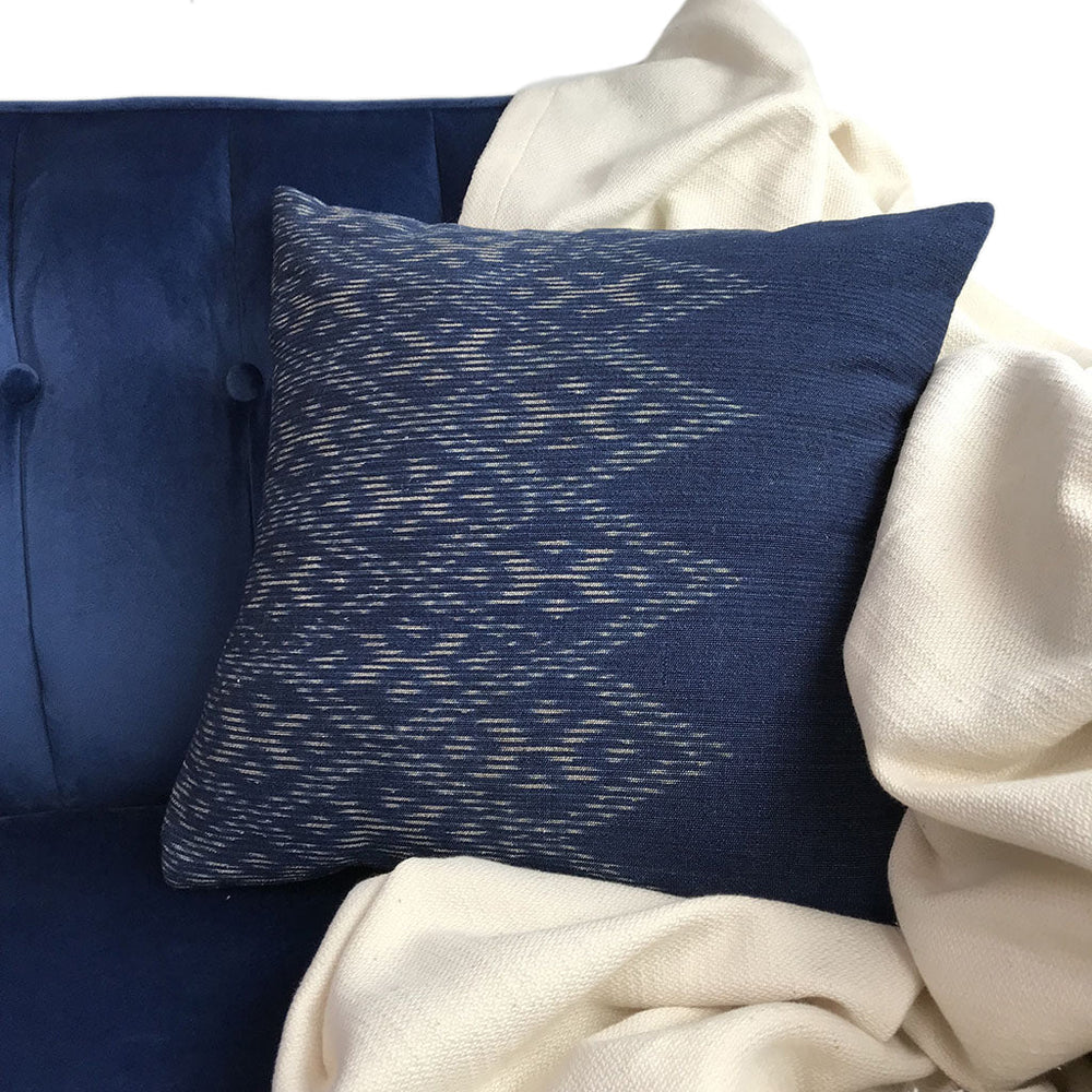 Hand-dyed indigo diamond pillow cover with a diamond pattern on soft fabric.