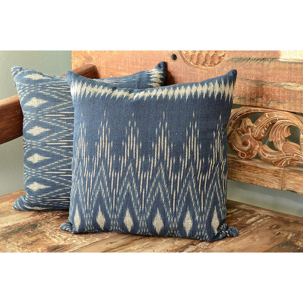 Handwoven indigo ikat pillow cover with a blue and white ikat pattern.