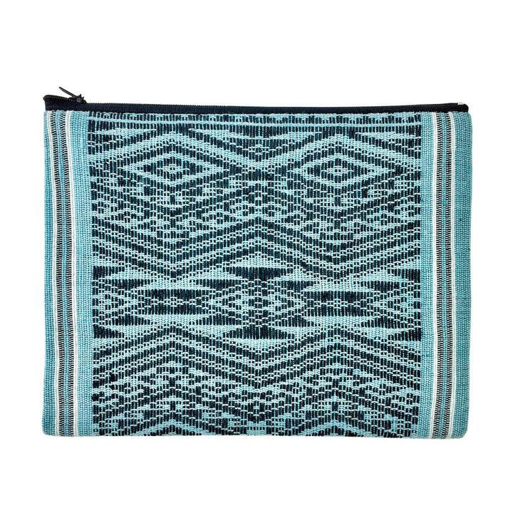 Woven saa-fiber Ocean Tribal clutch with a tribal pattern and compact design.