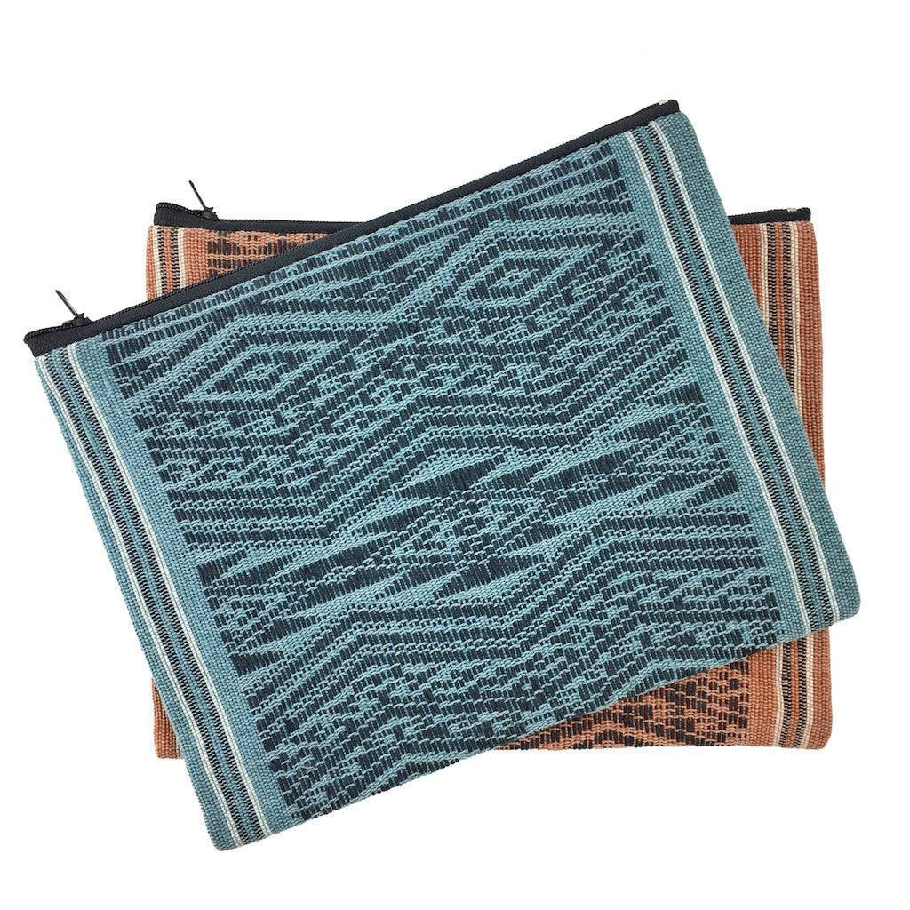 Woven Ocean Tribal clutch shown in natural light with a tribal pattern.