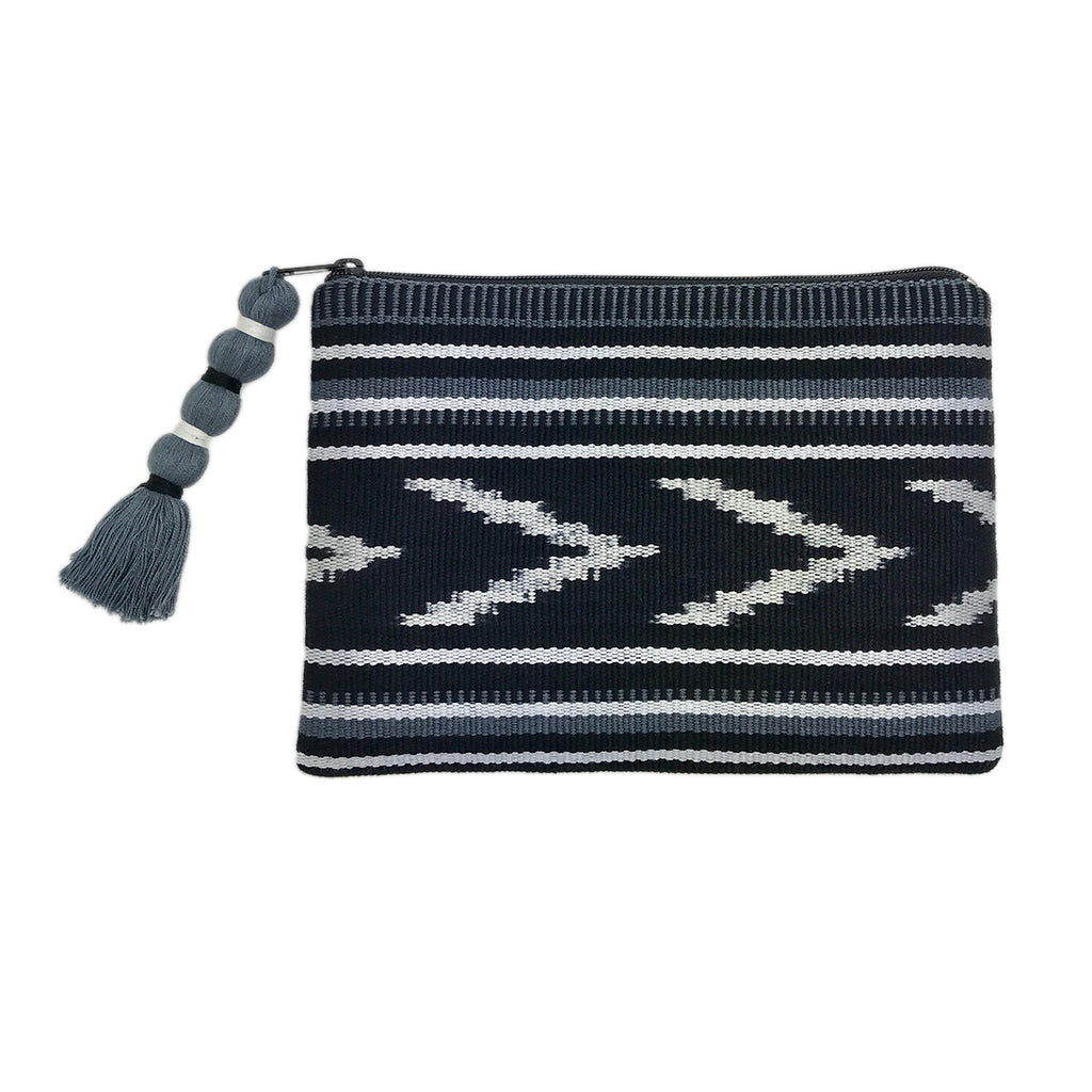 Indigo and tan ikat backstrap clutch with an intricate woven design and strap.