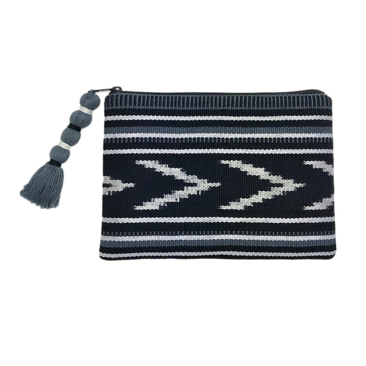 Indigo and tan ikat backstrap clutch with an intricate woven design and strap.