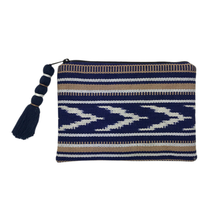 Indigo and tan ikat backstrap clutch with a woven pattern and strap.