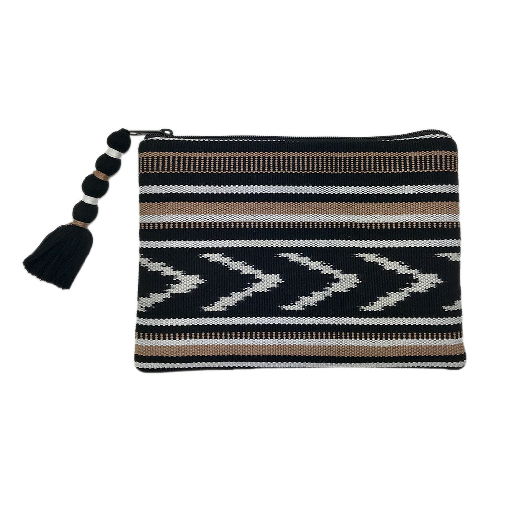 Indigo and tan ikat backstrap clutch with woven fabric, a casual accessory.
