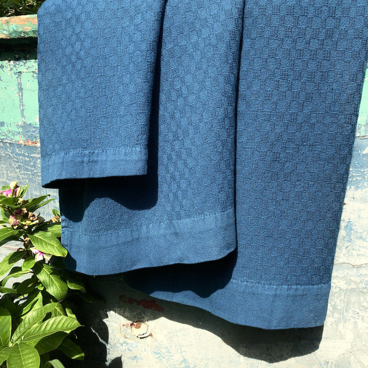 Set of 3 Turkish towels (bath, hand, washcloth) in textured oat-colored cotton.