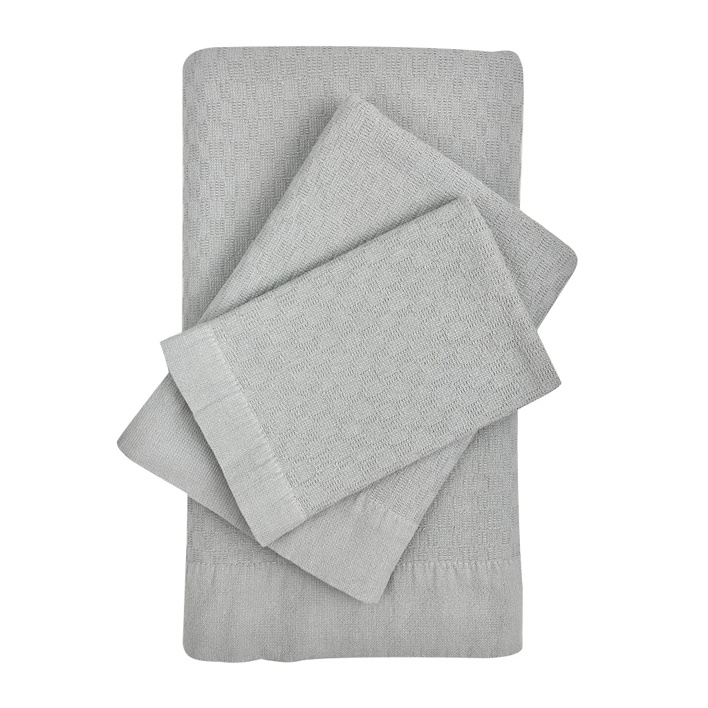 Set of 3 oat-colored Turkish towels (bath, hand, washcloth) in woven cotton.