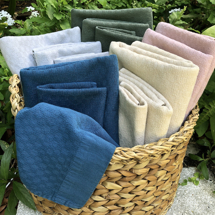 Set of 3 Turkish towels (bath, hand, washcloth) in soft oat-colored cotton.