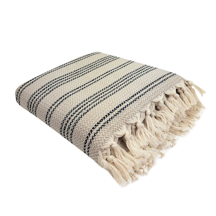 Woven stripe Turkish throw in sandy and ivory tones with a textured pattern.