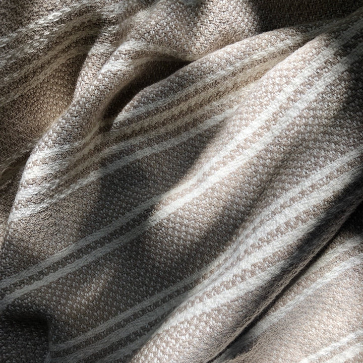 Woven stripe Turkish throw in beige and ivory for cozy home decor.