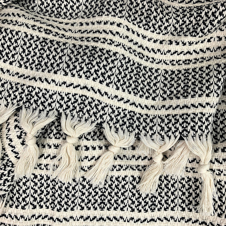 Woven stripe Turkish throw in beige and ivory, soft textured fabric.