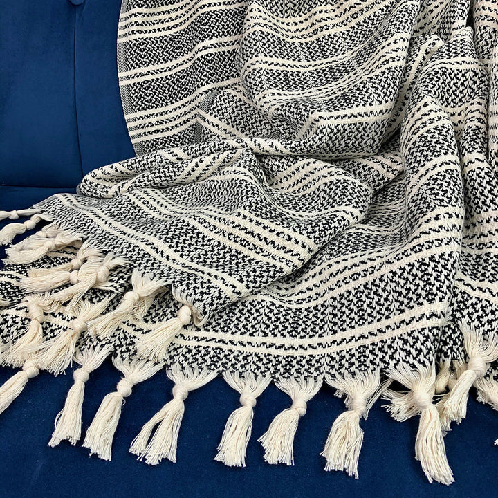Woven stripe Turkish throw in sand and ivory with a textured striped pattern.