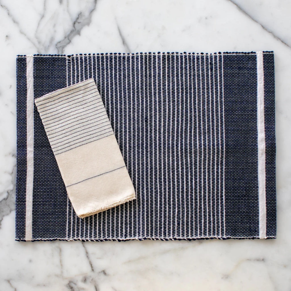 Ethiopian handloom striped placemat set of 2 in slate gray with a woven pattern.