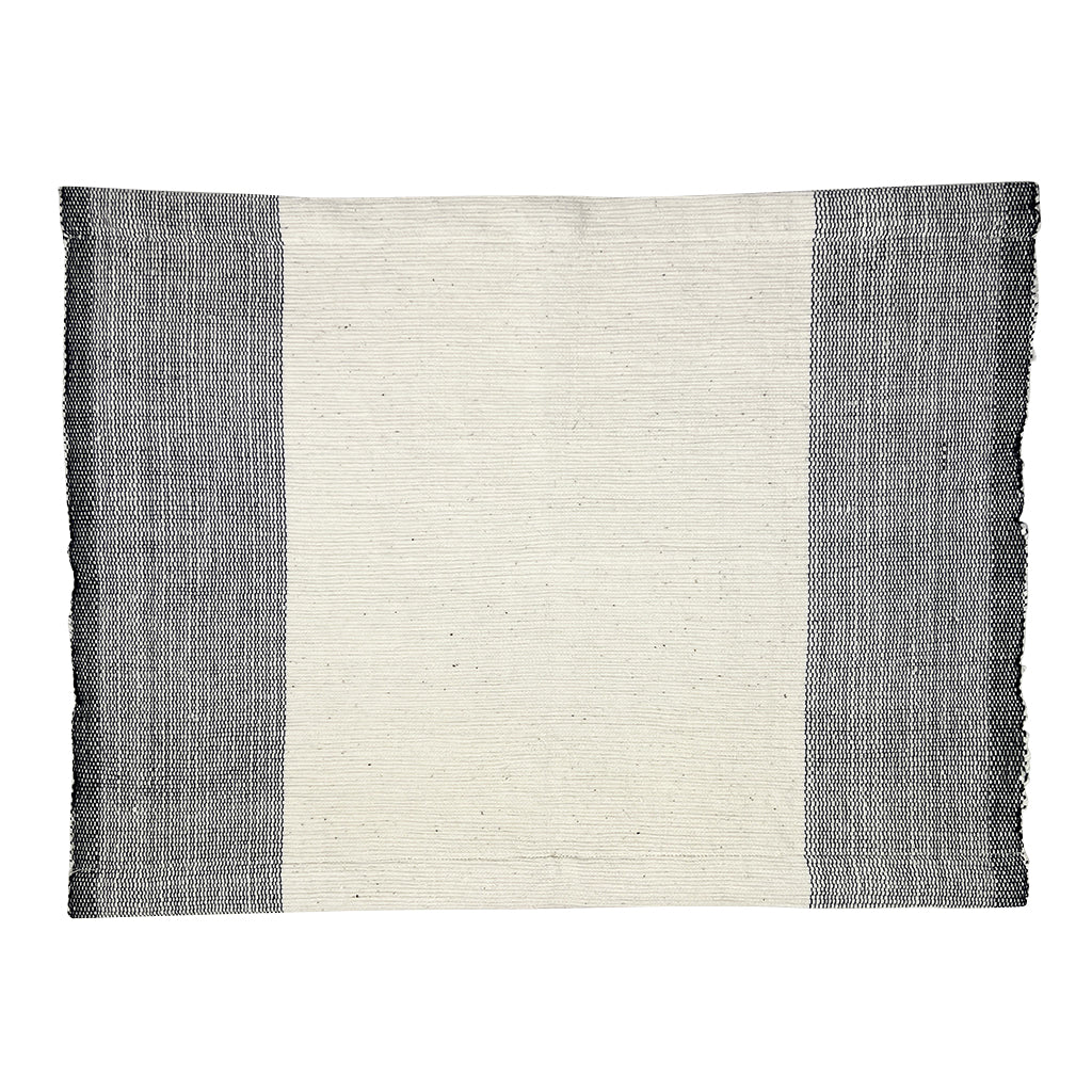 Handwoven cotton color block placemat set in natural and vibrant tones.