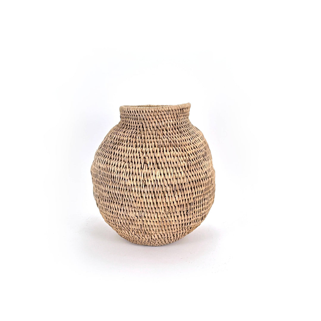 Buhera basket photographed from above, coiled cane visible around the opening