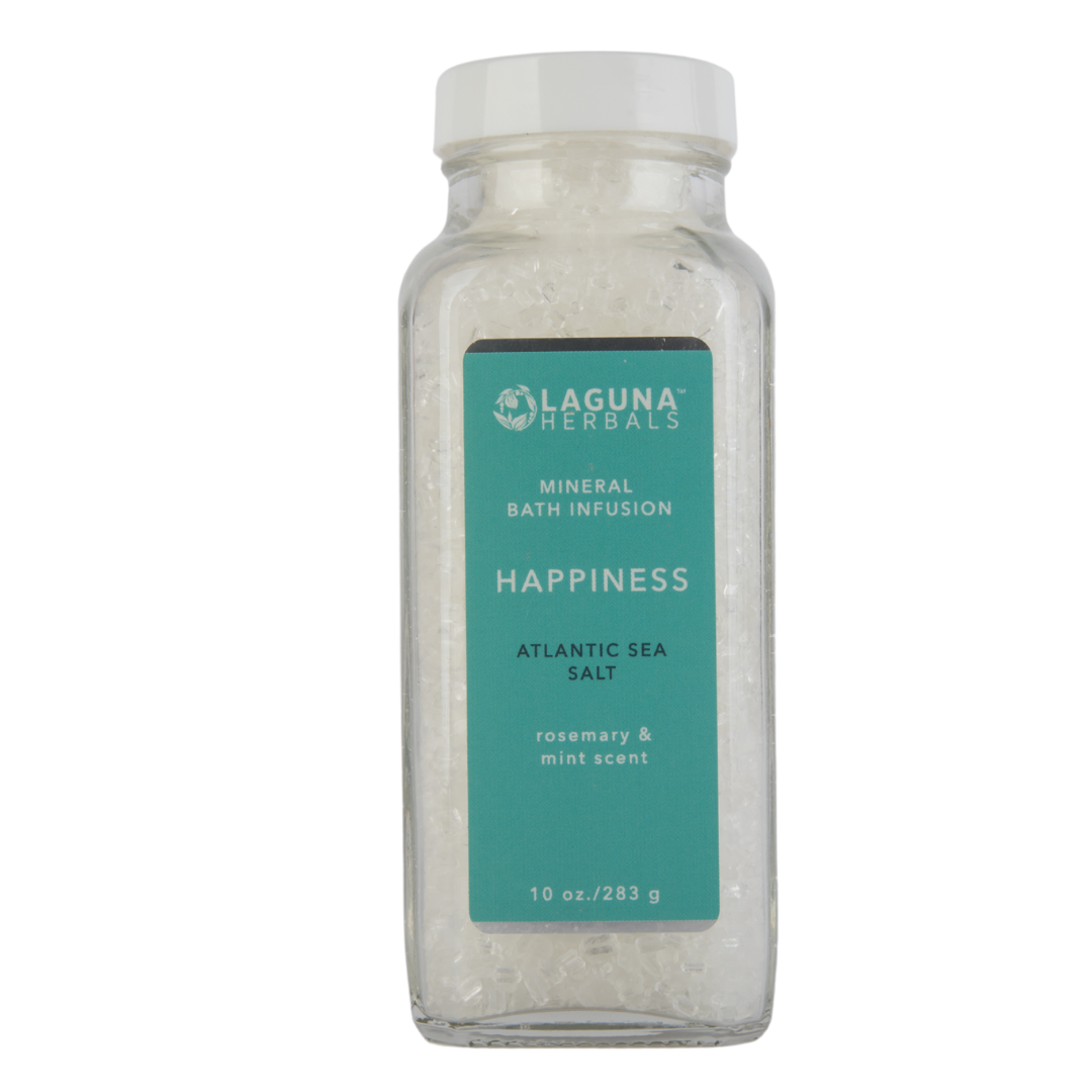 Happiness mineral bath salt in a clear jar, with sea salt, Epsom salt, and herbs.