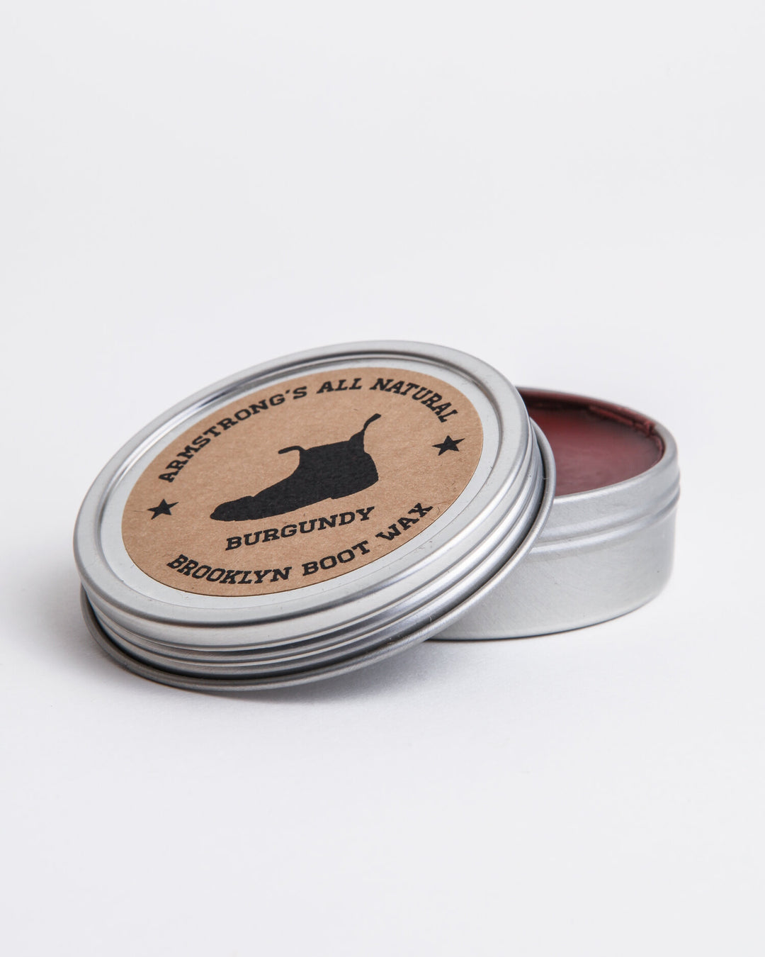 Brooklyn Boot Wax in pigmented black, shown applied to leather footwear.