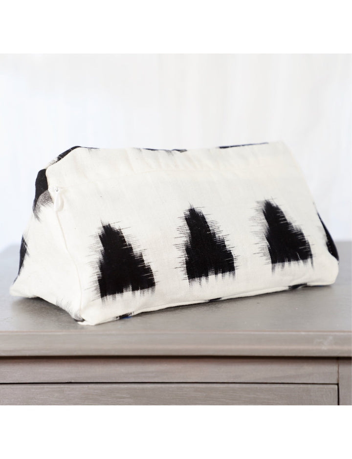 Handwoven cotton carry-all toiletry bag with a zipper closure.