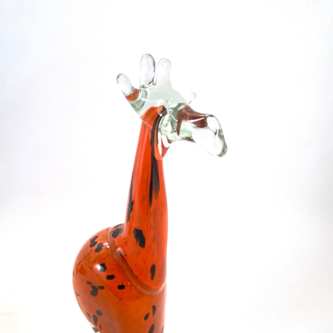 Vibrant orange recycled-glass giraffe sculpture, handmade in Eswatini.