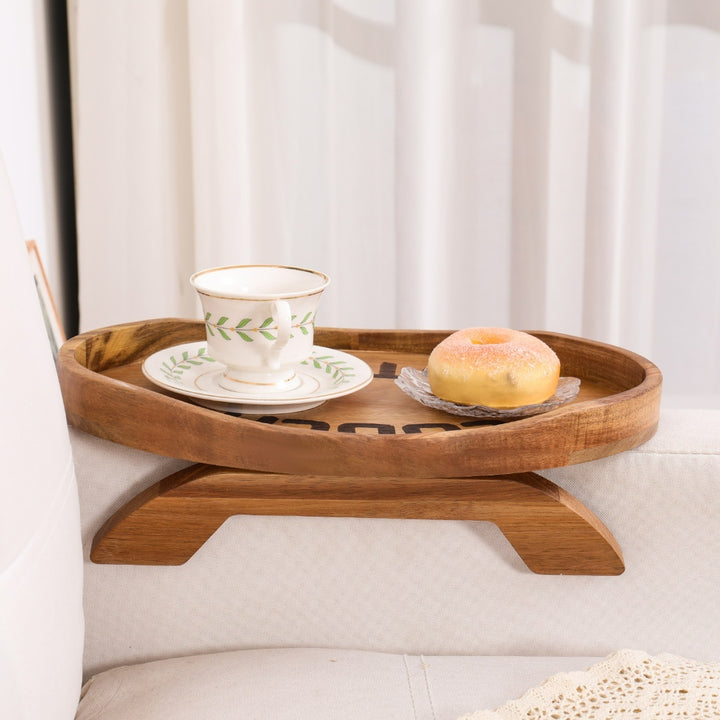 Acacia wood clip-on sofa tray with a natural wood finish for the sofa armrest.