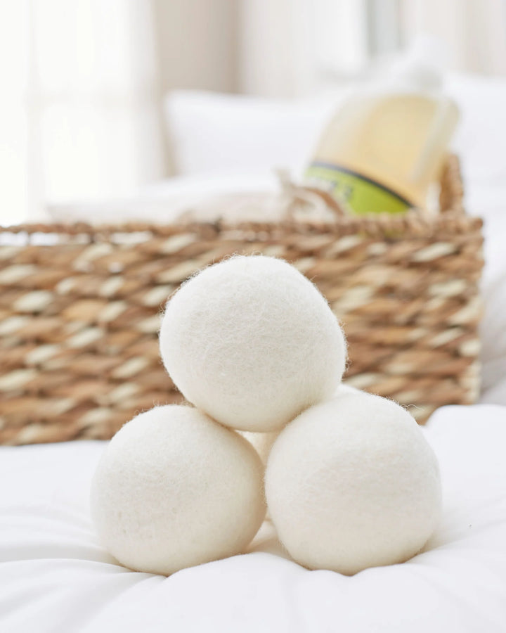 Set of three LanaDown felted wool dryer balls for softening laundry and reducing drying time.