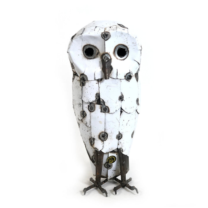 Handcrafted recycled metal snowy owl with detailed feathers in a perched stance.