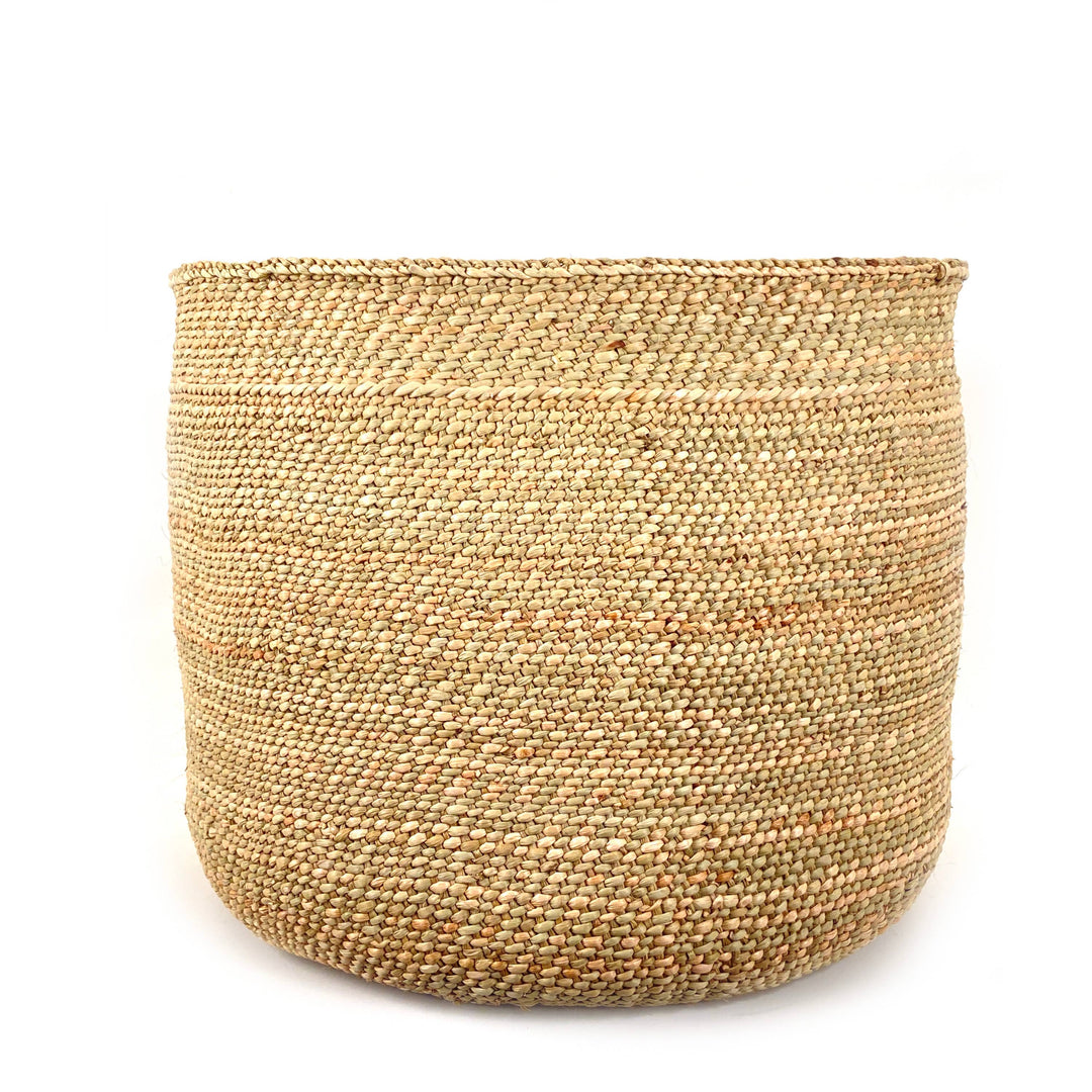Natural Iringa grass basket, side view showing the plaited braid finishing the top edge
