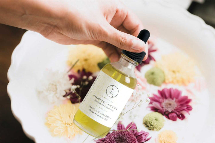 Grapefruit body oil with fresh grapefruit and a smooth, hydrating texture.