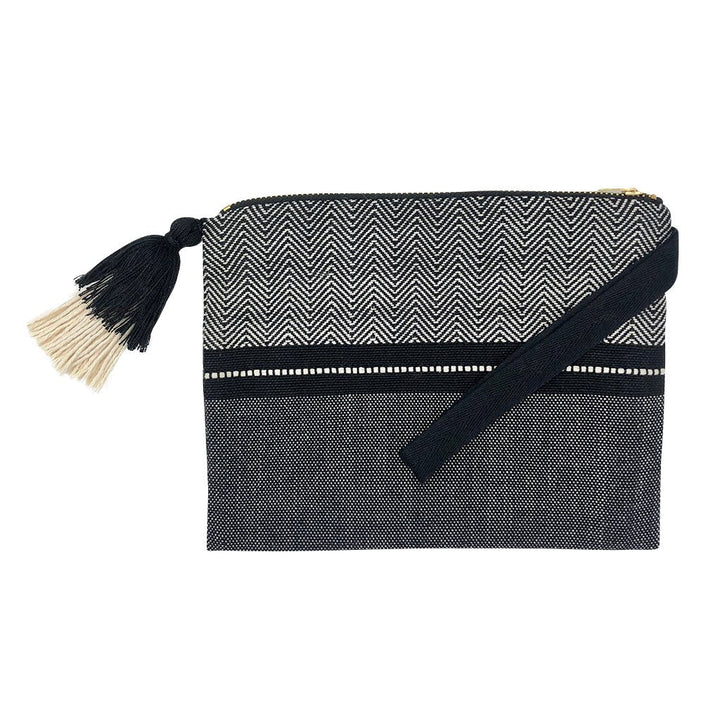 Handloom stripe cosmetic clutch with a colorful woven pattern and zipper.