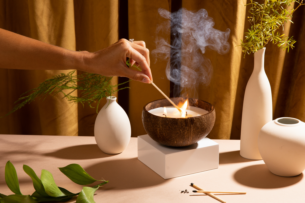 Soy wax candle in a rustic coconut-shell holder.